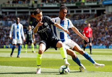 The American Express Community Stadium, Brighton, Britain - May 12, 2019 Manchester City's Bernardo Silva in action with Brighton's Bernardo