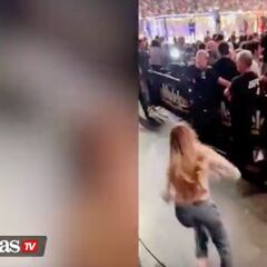 A woman tries to sneak into a UFC ring and what happens to her is karma at its finest