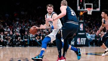 Mar 14, 2019; Denver, CO, USA; Denver Nuggets forward Mason Plumlee (24) guards Dallas Mavericks forward Luka Doncic (77) in the fourth quarter at the Pepsi Center. Mandatory Credit: Isaiah J. Downing-USA TODAY Sports