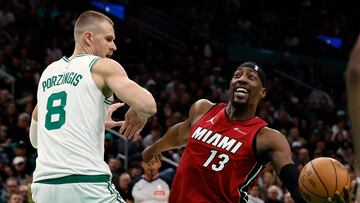 BOSTON, MA - APRIL 21: Bam Adebayo #13 of the Miami Heat looks to go past Kristaps Porzingis #8 of the Boston Celtics during the first quarter of game one of the Eastern Conference First Round Playoffs at TD Garden on April 21, 2024 in Boston, Massachusetts. NOTE TO USER: User expressly acknowledges and agrees that, by downloading and/or using this Photograph, user is consenting to the terms and conditions of the Getty Images License Agreement. (Photo By Winslow Townson/Getty Images) (Photo by Winslow Townson / GETTY IMAGES NORTH AMERICA / Getty Images via AFP)