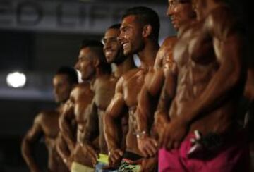 Competitors flex their muscles during the Arnold Classic Europe bodybuilding event in Barcelona, Spain, Saturday, Sept. 24