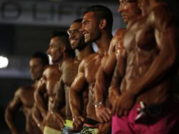 Competitors flex their muscles during the Arnold Classic Europe bodybuilding event in Barcelona, Spain, Saturday, Sept. 24