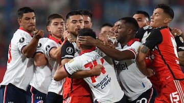 Players of Nacional and River Plate fight during the Copa Libertadores group stage second leg football match between Uruguay's Nacional and Argentina's River Plate at the Gran Parque Central stadium in Montevideo on May 7, 2024. (Photo by DANTE FERNANDEZ / AFP)