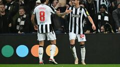 Newcastle United's Paraguayan midfielder #24 Miguel Almiron (R) celebrates scoring the opening goal during the UEFA Champions League Group F football match between Newcastle United and Paris Saint-Germain at St James' Park in Newcastle-upon-Tyne, north east England on October 4, 2023. (Photo by Paul ELLIS / AFP) / RESTRICTED TO EDITORIAL USE. No use with unauthorized audio, video, data, fixture lists, club/league logos or 'live' services. Online in-match use limited to 120 images. An additional 40 images may be used in extra time. No video emulation. Social media in-match use limited to 120 images. An additional 40 images may be used in extra time. No use in betting publications, games or single club/league/player publications. / 