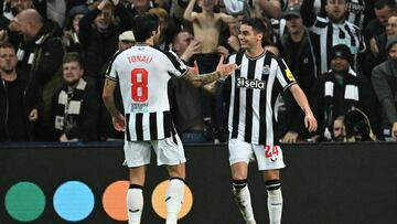 Newcastle United's Paraguayan midfielder #24 Miguel Almiron (R) celebrates scoring the opening goal during the UEFA Champions League Group F football match between Newcastle United and Paris Saint-Germain at St James' Park in Newcastle-upon-Tyne, north east England on October 4, 2023. (Photo by Paul ELLIS / AFP) / RESTRICTED TO EDITORIAL USE. No use with unauthorized audio, video, data, fixture lists, club/league logos or 'live' services. Online in-match use limited to 120 images. An additional 40 images may be used in extra time. No video emulation. Social media in-match use limited to 120 images. An additional 40 images may be used in extra time. No use in betting publications, games or single club/league/player publications. / 