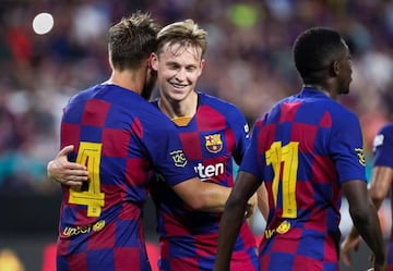 07 August 2019, US, Miami Gardens: Barcelona's Ivan Rakitic (L) celebrates scoring his side's second goal with teammate Frenkie de Jong (C) during the pre-Season friendly soccer match between FC Barcelona and SSC Napoli at the Hard Rock Stadium.