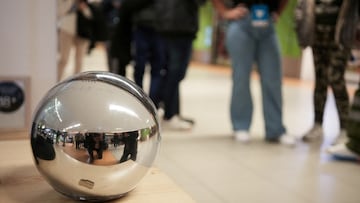 FILE PHOTO: People queue to use WorldCoin's iris-scanners in Madrid, Spain, March 6, 2024. REUTERS/ Antoine Demaison/File Photo