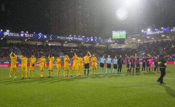 The teams line up before the game.
