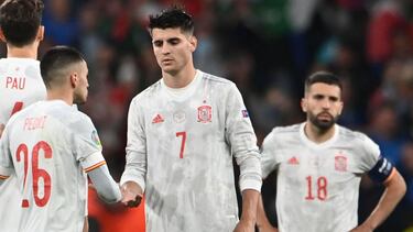 TOPSHOT - Spain's forward Alvaro Morata (C) is consoled by teammates after his miss during the UEFA EURO 2020 semi-final football match between Italy and Spain at Wembley Stadium in London on July 6, 2021. (Photo by Andy Rain / POOL / AFP)