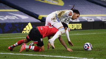 LEEDS, ENGLAND - FEBRUARY 23: Helder Costa of Leeds United and Ryan Bertrand of Southampton battle for possession during the Premier League match between Leeds United and Southampton at Elland Road on February 23, 2021 in Leeds, England. Sporting stadiums