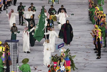 2016 Rio Olympics - Opening ceremony - Maracana - Rio de Janeiro, Brazil - 05/08/2016. Flagbearer Sulaiman Hamad (KSA) of Saudi Arabia leads his contingent during the opening ceremony.  REUTERS/Stoyan Nenov FOR EDITORIAL USE ONLY. NOT FOR SALE FOR MARKETING OR ADVERTISING CAMPAIGNS.  