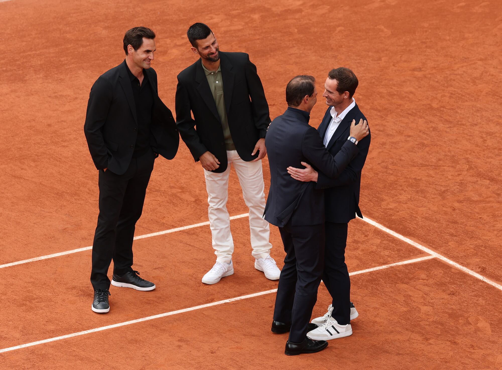 Roger Federer, Novak Djokovic y Andy Murray acompañan a Rafa Nadal durante su homenaje. 