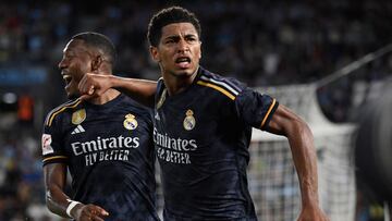 Real Madrid's English midfielder #5 Jude Bellingham (R) celebrates his goal next to Real Madrid's Austrian defender #04 David Alaba during the Spanish Liga football match between RC Celta de Vigo and Real Madrid CF at the Balaidos stadium in Vigo on August 25, 2023. (Photo by MIGUEL RIOPA / AFP)