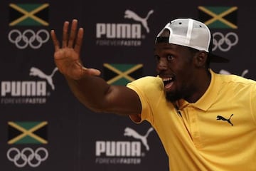 Usain Bolt gestures during a Jamaican Olympic Association and Puma press conference at the Cidade Das Artes in Rio de Janeiro on August 8, 2016. / AFP PHOTO / Adrian DENNIS