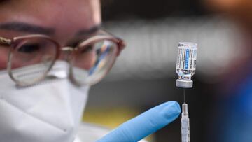 (FILES) In this file photo taken on August 07, 2021 (FILES) In this file photo taken on August 7, 2021, a dose of the Johnson and Johnson Covid-19 vaccine is prepared at a mobile vaccination clinic at the Weingart East Los Angeles YMCA in Los Angeles, California. - Drug maker Johnson & Johnson asked the US Federal Drug Administration on October 5, 2021, to authorize booster shots of its Covid-19 vaccine for people over the age of 18. "Our clinical program has found that a booster of our Covid-19 vaccine increases levels of protection for those who have received our single-shot vaccine to 94 percent," said Mathai Mammen, global head of research and development at J&J. (Photo by Patrick T. FALLON / AFP)