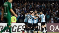 Argentina's Racing Carlos Alcaraz (covered) celebrates with teammates after scoring a goal against Brazil's Cuiaba during their Copa Sudamericana group stage first leg football match at the Presidente Juan Domingo Peron stadium in Buenos Aires, on April 13, 2022. (Photo by ALEJANDRO PAGNI / AFP) (Photo by ALEJANDRO PAGNI/AFP via Getty Images)