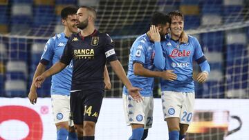 Napoli's Piotr Zielinski, right, celebrates after scoring during the Serie A soccer match between Napoli and Genoa at the San Paolo Stadium in Naples, Italy, Sunday, Sept. 27, 2020. (Alessandro Garofalo/LaPresse via AP)