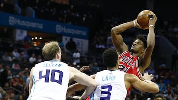 Mar 13, 2017; Charlotte, NC, USA; Chicago Bulls forward Jimmy Butler (21) shoots the ball as Charlotte Hornets guard Jeremy Lamb (3) defends in the second half at Spectrum Center. The Bulls won 115-109. Mandatory Credit: Jeremy Brevard-USA TODAY Sports