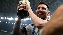 Argentina's captain and forward #10 Lionel Messi holds the FIFA World Cup Trophy following the trophy ceremony after Argentina won the Qatar 2022 World Cup final football match between Argentina and France at Lusail Stadium in Lusail, north of Doha on December 18, 2022. (Photo by Anne-Christine POUJOULAT / AFP)