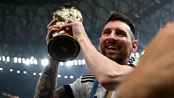 Argentina's captain and forward #10 Lionel Messi holds the FIFA World Cup Trophy following the trophy ceremony after Argentina won the Qatar 2022 World Cup final football match between Argentina and France at Lusail Stadium in Lusail, north of Doha on December 18, 2022. (Photo by Anne-Christine POUJOULAT / AFP)