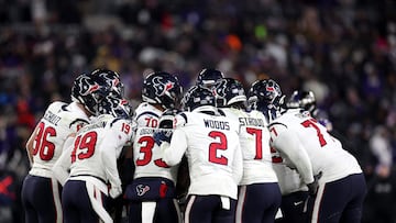 BALTIMORE, MARYLAND - JANUARY 20: Members of the Houston Texans offense huddle against the Baltimore Ravens in the second half at M&T Bank Stadium on January 20, 2024 in Baltimore, Maryland.   Rob Carr/Getty Images/AFP (Photo by Rob Carr / GETTY IMAGES NORTH AMERICA / Getty Images via AFP)