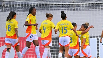 Colombia's defender #16 Jorelyn Carabali (R) celebrates with teammates after scoring her team's seventh goal during the Women's Copa America 2025 football match between Colombia and Bolivia, at the Gonzalo Pozo Ripalda stadium in Quito on July 22, 2025. (Photo by Rodrigo BUENDIA / AFP)