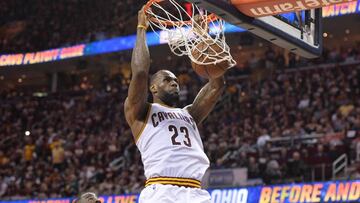 Jun 8, 2016; Cleveland, OH, USA; Cleveland Cavaliers forward LeBron James (23) dunks the ball in front of Golden State Warriors forward Draymond Green (23) during the four quarter in game three of the NBA Finals at Quicken Loans Arena. Mandatory Credit: Ken Blaze-USA TODAY Sports