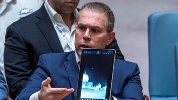 Israel's Ambassador to the United Nations Gilad Erdan shows a video of the missile attacks as he speaks to members of the Security Council during a meeting on the situation in the Middle East at U.N. headquarters in New York City, New York, U.S., April 14, 2024. REUTERS/Eduardo Munoz TPX IMAGES OF THE DAY