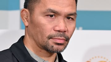 Retired multiple world boxing champion Manny Pacquiao of the Philippines poses during a photo session at the end of a press conference at a hotel in Tokyo on June 10, 2024. Boxing great Manny Pacquiao said June 10 that he is in negotiations to make a comeback but cautioned that a potential world title fight against Mario Barrios was "far away". (Photo by Kazuhiro NOGI / AFP)