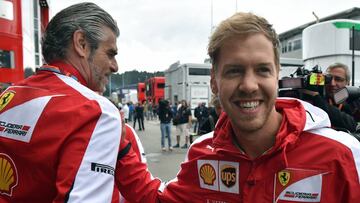 Ferrari's German driver Sebastian Vettel (R) greets Ferrari'sTeam Chief Maurizio Arrivabene ahead of the third practice session at the Red Bull Ring in Spielberg on June 20, 2015, ahead of the Austrian Formula One Grand Prix. AFP PHOTO / ANDREJ
