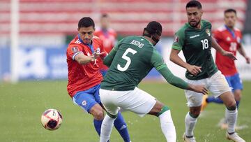 Soccer Football - World Cup - South American Qualifiers - Bolivia v Chile - Olympic Stadium Hernando Siles, La Paz, Bolivia - February 1, 2022 Bolivia's Adriano Jusino in action with Chile's Alexis Sanchez REUTERS/Manuel Claure