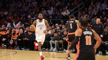 Los Angeles Lakers forward LeBron James (6) brings the ball up court against New York Knicks forward Obi Toppin (1) and guard Jalen Brunson (11) during the third quarter at Madison Square Garden.