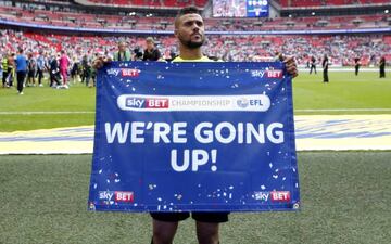 Huddersfield Town's Elias Kachunga celebrates after winning the Sky Bet Championship Play-Off Final and getting promoted to the Premier League