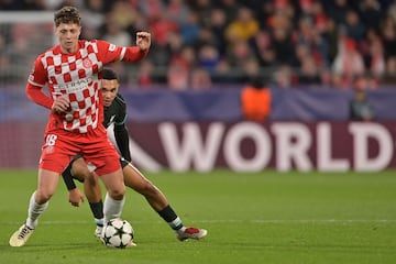 TOPSHOT - Girona's Czech defender #18 Ladislav Krejci and Liverpool's English defender #66 Trent Alexander-Arnold fight for the ball during the UEFA Champions League, league phase football match between Girona FC and Liverpool FC at the Montilivi stadium in Girona on December 10, 2024. (Photo by MANAURE QUINTERO / AFP)