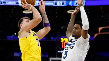LOS ANGELES, CALIFORNIA - OCTOBER 24: Luka Doncic #77 of the Los Angeles Lakers takes a shot against Jaden McDaniels #3 of the Minnesota Timberwolves in the first half at Crypto.com Arena on October 24, 2025 in Los Angeles, California. NOTE TO USER: User expressly acknowledges and agrees that, by downloading and or using this photograph, User is consenting to the terms and conditions of the Getty Images License Agreement. Ronald Martinez/Getty Images/AFP (Photo by RONALD MARTINEZ / GETTY IMAGES NORTH AMERICA / Getty Images via AFP)