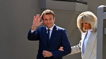 LE TOUQUET-PARIS-PLAGE, FRANCE - APRIL 24: Emmanuel Macron salutes voters as he leaves his house with Brigitte Macron to go vote on April 24, 2022 in Le Touquet-Paris-Plage, France. Emmanuel Macron and Marine Le Pen were both qualified on Sunday April 10th for France's 2022 presidential election second round to be held on April 24. This is the second consecutive time the two candidates face-off in the final round of elections. (Photo by Aurelien Meunier/Getty Images)