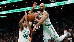 Boston Celtics guard Derrick White (9) jumps in to try to knock the ball away from Miami Heat forward Kevin Love (42) during the second half at TD Garden.