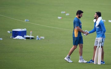 India's Virat Kohli (right) shakes hands with Pakistan's captain Shahid Afridi in training session at The Eden Gardens Cricket Stadium in Kolkata.