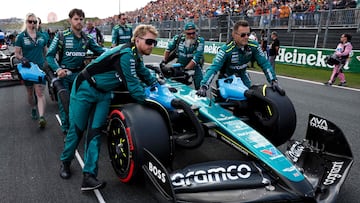Aston Martin's mechanics move the car of Aston Martin's Spanish driver Fernando Alonso ahead of the Formula One Dutch Grand Prix at The Circuit Zandvoort, western Netherlands, on August 25, 2024. (Photo by SIMON WOHLFAHRT / AFP)