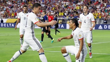 Carlos Bacca #7 of Colombia celebrates with James Rodriguez #10 after Bacca scored a first half goal against the United States