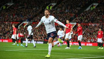 MANCHESTER, ENGLAND - OCTOBER 20: Adam Lallana of Liverpool celebrates after scoring his sides first goal during the Premier League match between Manchester United and Liverpool FC at Old Trafford on October 20, 2019 in Manchester, United Kingdom. (Photo