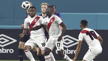 Peru&#039;s forward Jefferson Farfan (10) and Luis Advicula (17) drive the ball from Croatia&#039;s Ivan Rakitic, center back, in the first half of an exhibition soccer match Friday, March 23, 2018, in Miami. (Pedro Portal/Miami Herald via AP)