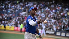 Tiburones de la Guaira's Cuban baseball player Yasiel Puig throws the ball during the Venezuelan Baseball League game between Leones del Caracas and Tiburones de la Guaira at the Simon Bolivar Monumental Stadium in Caracas, on January 7, 2024. (Photo by Federico PARRA / AFP)