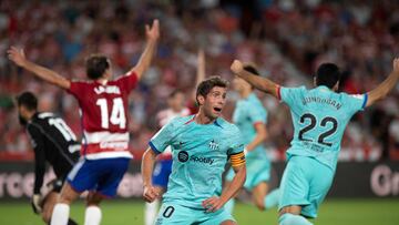 Barcelona's Spanish midfielder #20 Sergi Roberto celebrates after scoring his team's second goal during the Spanish league football match between Granada FC and FC Barcelona at the Nuevo Estadio de Los Carmenes in Granada on October 8, 2023. (Photo by JORGE GUERRERO / AFP)