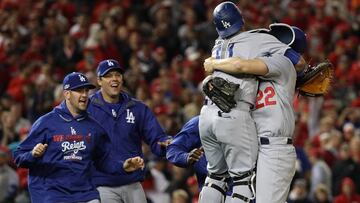 WASHINGTON, DC - OCTOBER 13: Clayton Kershaw #22 of the Los Angeles Dodgers celebrates with teammate Carlos Ruiz #51 after winning game five of the National League Division Series over the Washington Nationals 4-3 at Nationals Park on October 13, 2016 in Washington, DC. Patrick Smith/Getty Images/AFP
== FOR NEWSPAPERS, INTERNET, TELCOS & TELEVISION USE ONLY ==