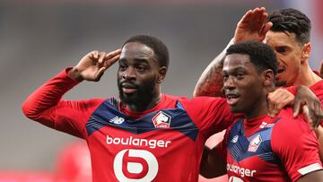 Soccer Football - Ligue 1 - Lille v Olympique de Marseille - Stade Pierre-Mauroy, Lille, France - March 3, 2021 Lille's Jonathan David celebrates scoring their first goal with teammates REUTERS/Pascal Rossignol