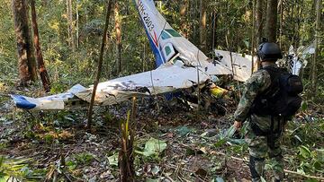 A soldier stands next to the wreckage of a plane during the search for child survivors from a Cessna 206 plane that crashed in the jungle more than two weeks ago in the jungles of Caqueta, Colombia May 19, 2023. Colombian Military Forces/Handout via REUTERS  ATTENTION EDITORS - THIS IMAGE WAS PROVIDED BY A THIRD PARTY. MANDATORY CREDIT. NO RESALES. NO ARCHIVES