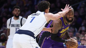 LOS ANGELES, CALIFORNIA - FEBRUARY 25: Dwight Powell #7 of the Dallas Mavericks defends against LeBron James #23 of the Los Angeles Lakers during the second half of a game at Crypto.com Arena on February 25, 2025 in Los Angeles, California. Sean M. Haffey/Getty Images/AFP (Photo by Sean M. Haffey / GETTY IMAGES NORTH AMERICA / Getty Images via AFP)