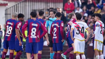 MADRID, SPAIN - NOVEMBER 25: Referee Jose Luis Munuera Montero gestures to award Rayo Vallecano's first goal scored by Unai Lopez of Rayo Vallecano (not pictured) following a VAR check during the LaLiga EA Sports match between Rayo Vallecano and FC Barcelona at Estadio de Vallecas on November 25, 2023 in Madrid, Spain. (Photo by Angel Martinez/Getty Images)