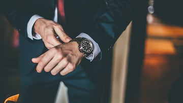 Well Dressed Man putting his wrist watch